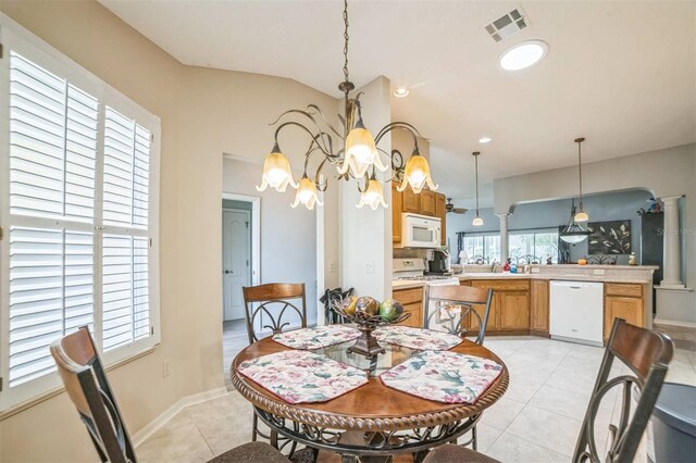 17567 SE 81st Parnassus Ct, The Villages, FL 32162 - dining space featuring a chandelier and light tile patterned flooring