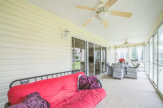 17567 SE 81st Parnassus Ct, The Villages, FL 32162 - sunroom with a ceiling fan and outdoor dining area