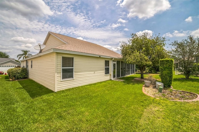 17567 SE 81st Parnassus Ct, The Villages, FL 32162 - rear view of house with a lawn, a sunroom, and a shingled roof