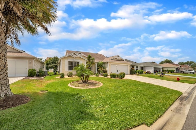 17567 SE 81st Parnassus Ct, The Villages, FL 32162 - view of front of home with concrete driveway, an attached garage, and a front yard