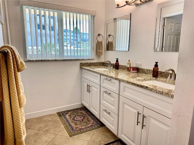 100 Bluff View Dr Unit 115C, Belleair Bluffs, FL 33770 - full bathroom featuring double vanity and tile patterned floors