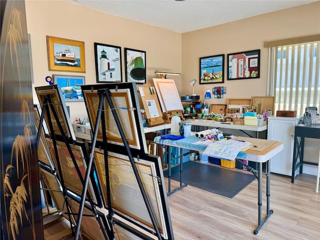 100 Bluff View Dr Unit 115C, Belleair Bluffs, FL 33770 - office area featuring wood finished floors and a textured ceiling