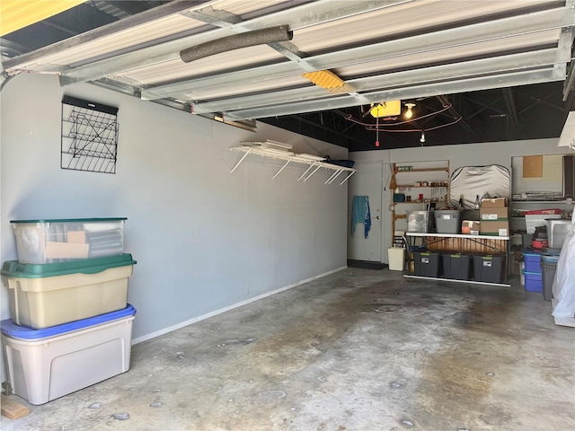 100 Bluff View Dr Unit 115C, Belleair Bluffs, FL 33770 - garage featuring baseboards