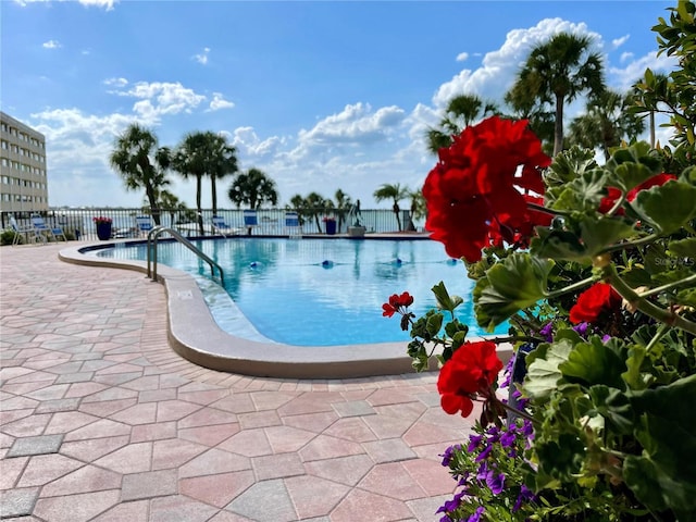 100 Bluff View Dr Unit 115C, Belleair Bluffs, FL 33770 - community pool featuring a patio