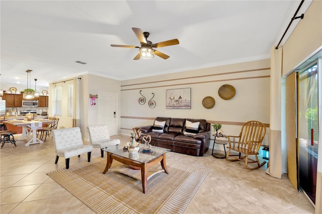 2022 Hawks View Dr, Ruskin, FL 33570 - living area with ceiling fan, ornamental molding, and light tile patterned floors
