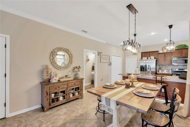 2022 Hawks View Dr, Ruskin, FL 33570 - dining space with crown molding, light tile patterned flooring, a chandelier, and recessed lighting