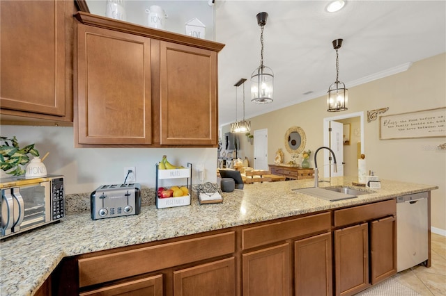 2022 Hawks View Dr, Ruskin, FL 33570 - kitchen featuring appliances with stainless steel finishes, brown cabinetry, and ornamental molding