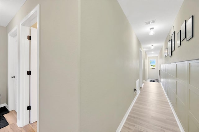 2022 Hawks View Dr, Ruskin, FL 33570 - hallway featuring light wood-style flooring and baseboards