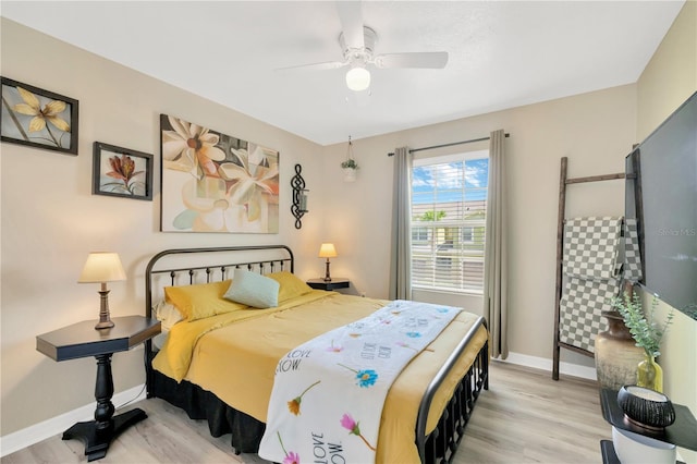 2022 Hawks View Dr, Ruskin, FL 33570 - bedroom featuring light wood finished floors and a ceiling fan