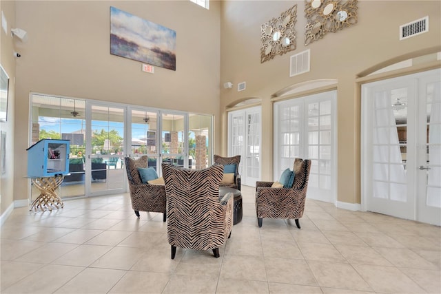 2022 Hawks View Dr, Ruskin, FL 33570 - tiled living room featuring french doors, a high ceiling, and arched walkways