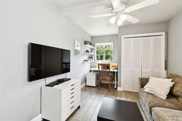 7219 4th Ave N, Saint Petersburg, FL 33710 - living area with an office area, light wood-style flooring, ceiling fan, and baseboards