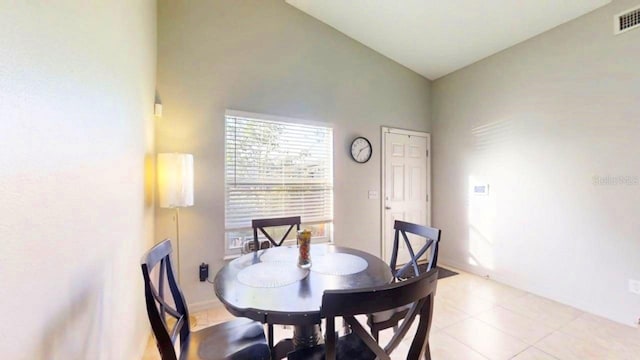 22798 Penny Loop, Land O Lakes, FL 34639 - dining space with high vaulted ceiling and light tile patterned floors