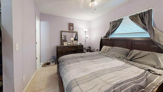 22798 Penny Loop, Land O Lakes, FL 34639 - bedroom with light tile patterned floors, baseboards, and a ceiling fan
