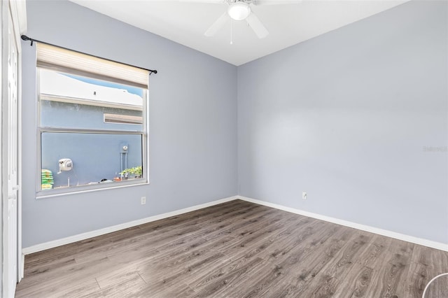 8521 30th St E, Parrish, FL 34219 - empty room with wood finished floors and ceiling fan