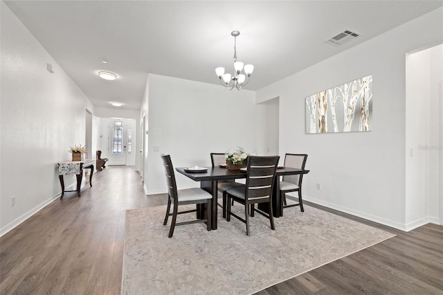 11434 Leland Groves Dr, Riverview, FL 33579 - dining space featuring dark wood-type flooring and a chandelier