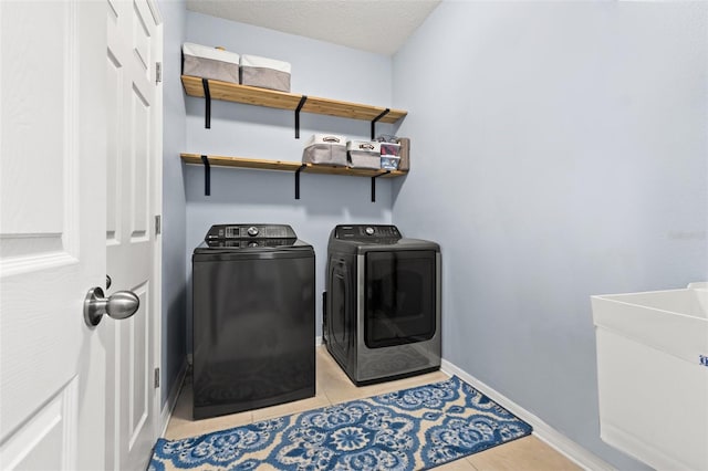 11434 Leland Groves Dr, Riverview, FL 33579 - laundry room with independent washer and dryer and light tile patterned floors
