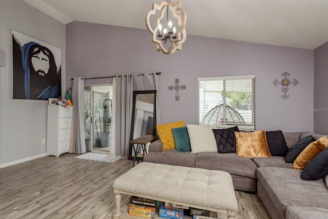 5826 Taywood Dr, Tampa, FL 33624 - living area with a chandelier, light wood-style flooring, baseboards, and high vaulted ceiling