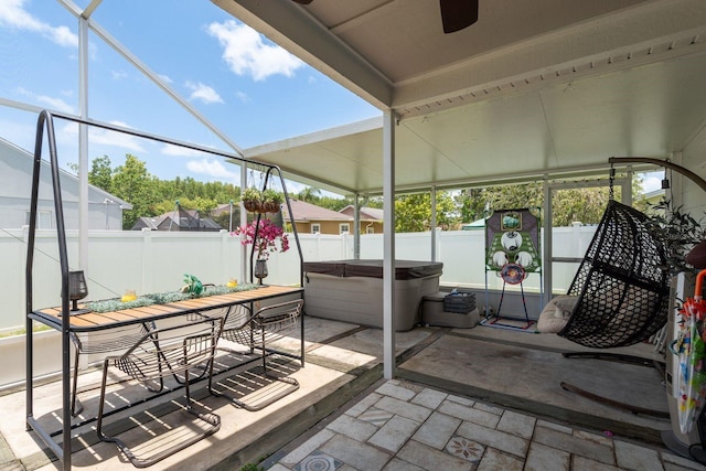 5826 Taywood Dr, Tampa, FL 33624 - sunroom with a jacuzzi, a ceiling fan, and plenty of natural light