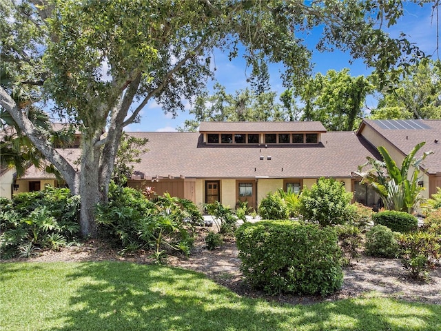 7705 4th Ave W, Bradenton, FL 34209 - view of front facade featuring a front lawn and a shingled roof