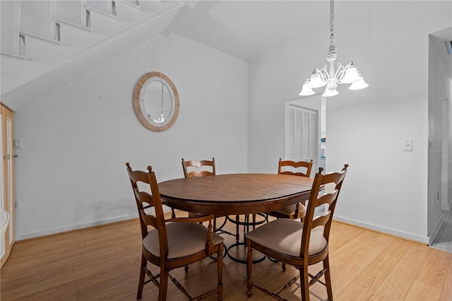 7705 4th Ave W, Bradenton, FL 34209 - dining space featuring light wood-style flooring, a chandelier, and lofted ceiling
