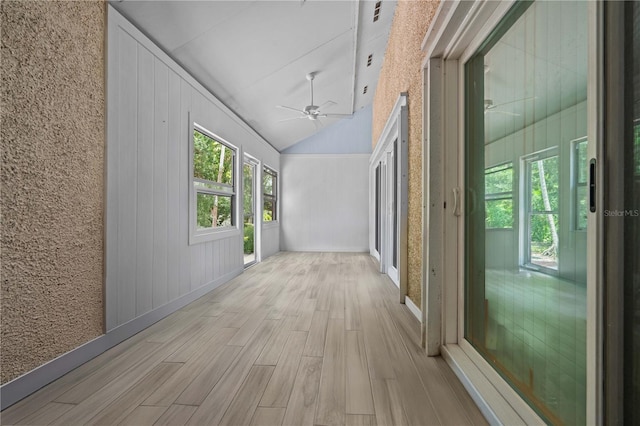 7705 4th Ave W, Bradenton, FL 34209 - corridor featuring light wood finished floors and high vaulted ceiling