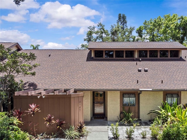 7705 4th Ave W, Bradenton, FL 34209 - view of front of property featuring a shingled roof and stucco siding