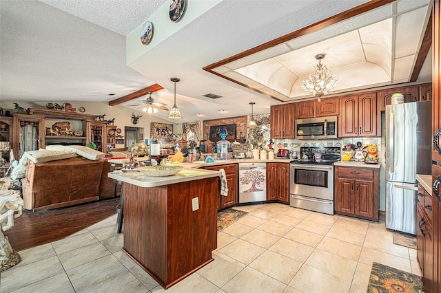 159 Canby Cir, Spring Hill, FL 34606 - kitchen with appliances with stainless steel finishes, light tile patterned floors, light countertops, pendant lighting, and a chandelier