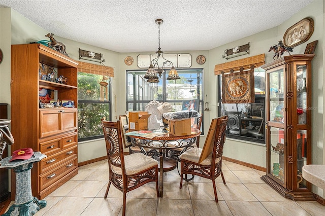 159 Canby Cir, Spring Hill, FL 34606 - dining space featuring light tile patterned floors, a textured ceiling, and a chandelier