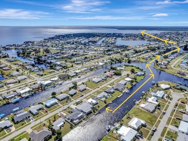 551 Lindley Ter, Port Charlotte, FL 33952 - aerial overview of property's location with a large body of water and nearby suburban area