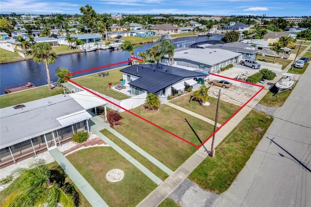 551 Lindley Ter, Port Charlotte, FL 33952 - aerial perspective of suburban area featuring a nearby body of water and property parcel outlined