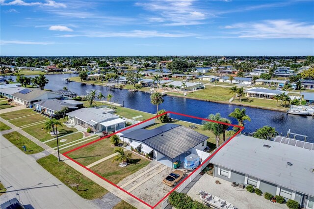 551 Lindley Ter, Port Charlotte, FL 33952 - aerial view of residential area with property parcel outlined and a large body of water