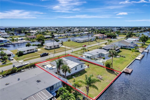 551 Lindley Ter, Port Charlotte, FL 33952 - aerial view of residential area featuring property parcel outlined and a large body of water