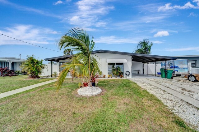 551 Lindley Ter, Port Charlotte, FL 33952 - single story home featuring dirt driveway, a carport, and stucco siding