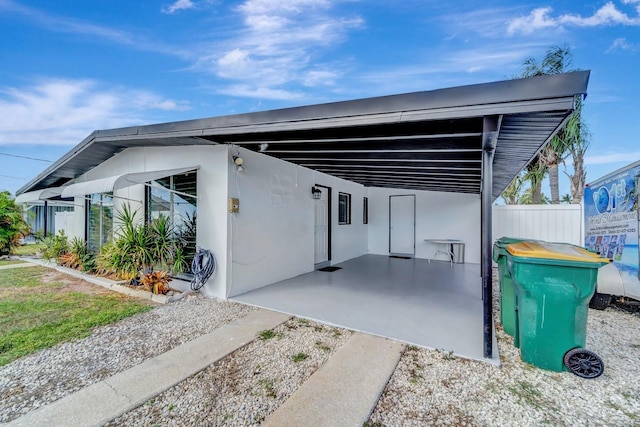 551 Lindley Ter, Port Charlotte, FL 33952 - view of front facade with a carport