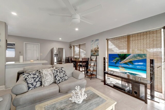 551 Lindley Ter, Port Charlotte, FL 33952 - living room with ceiling fan, light tile patterned flooring, and baseboards