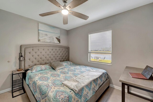 551 Lindley Ter, Port Charlotte, FL 33952 - tiled bedroom with baseboards and a ceiling fan