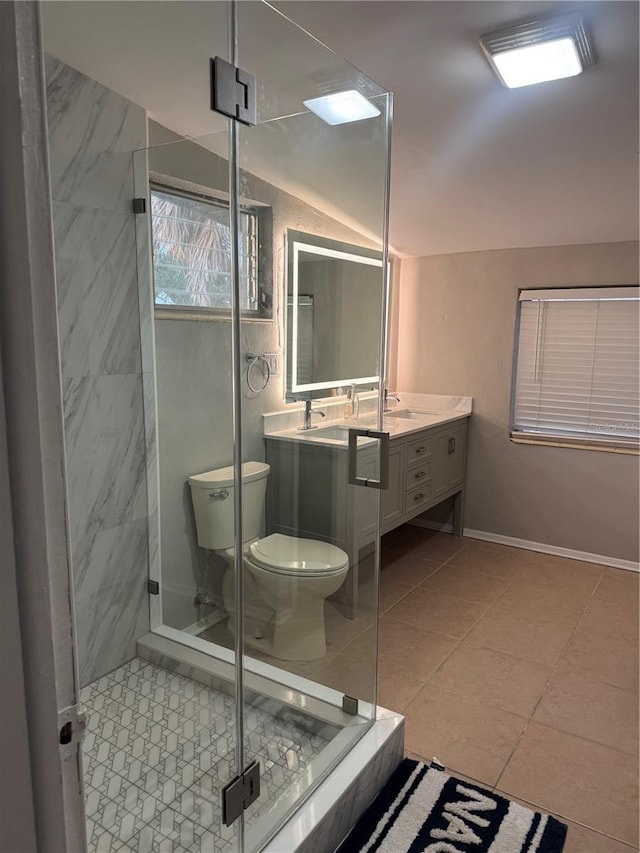 551 Lindley Ter, Port Charlotte, FL 33952 - bathroom featuring toilet, tile patterned flooring, vanity, a stall shower, and vaulted ceiling