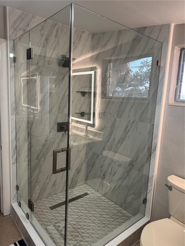 551 Lindley Ter, Port Charlotte, FL 33952 - bathroom with toilet and a marble finish shower
