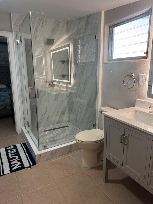 551 Lindley Ter, Port Charlotte, FL 33952 - full bathroom featuring tile patterned floors, vanity, a marble finish shower, and toilet