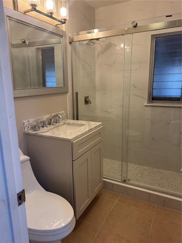 551 Lindley Ter, Port Charlotte, FL 33952 - bathroom with toilet, a stall shower, vanity, and tile patterned flooring