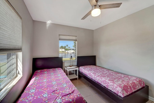 551 Lindley Ter, Port Charlotte, FL 33952 - tiled bedroom with a ceiling fan