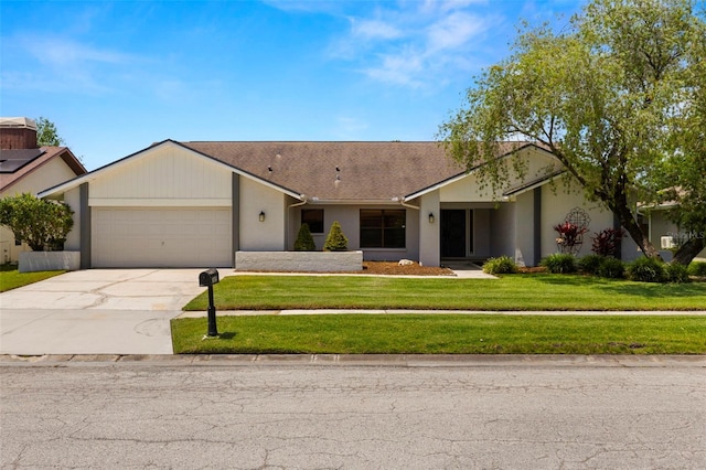 14164 Fennsbury Dr, Tampa, FL 33624 - single story home featuring an attached garage, driveway, a front lawn, stucco siding, and a shingled roof