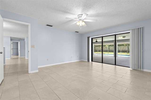 14164 Fennsbury Dr, Tampa, FL 33624 - spare room featuring ceiling fan, a textured ceiling, and baseboards
