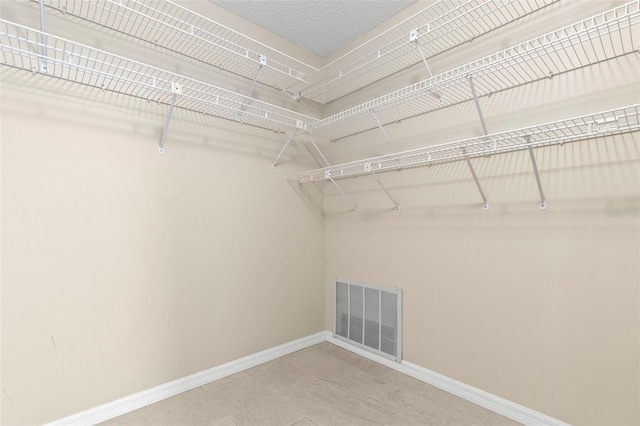 14164 Fennsbury Dr, Tampa, FL 33624 - spacious closet featuring tile patterned flooring