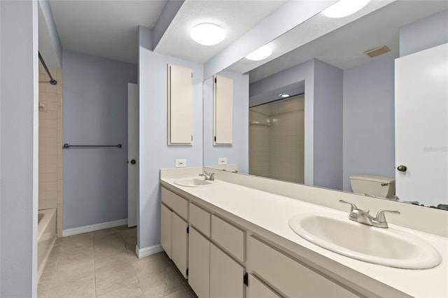 14164 Fennsbury Dr, Tampa, FL 33624 - full bath with toilet, double vanity,  shower combination, baseboards, and tile patterned flooring