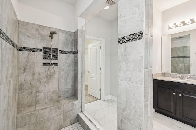 1553 Amber Leaf Cir, Ocoee, FL 34761 - full bath featuring tiled shower, vanity, and marble finish floors