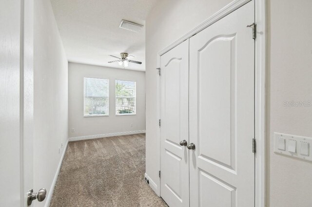 1553 Amber Leaf Cir, Ocoee, FL 34761 - hallway with carpet flooring and baseboards