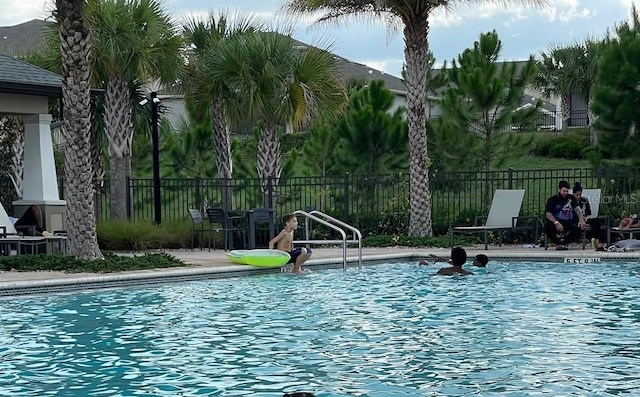 1553 Amber Leaf Cir, Ocoee, FL 34761 - community pool featuring a patio area