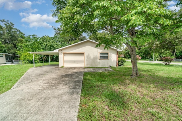 201 W New York Ave, Orange City, FL 32763 - view of front facade with stucco siding, an attached carport, and concrete driveway