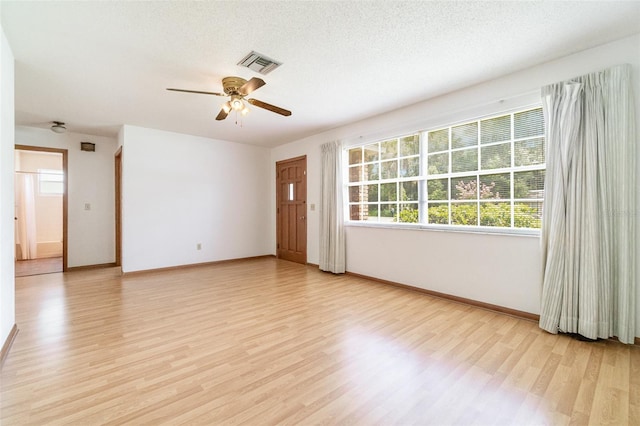 201 W New York Ave, Orange City, FL 32763 - empty room featuring light wood-style flooring and a ceiling fan